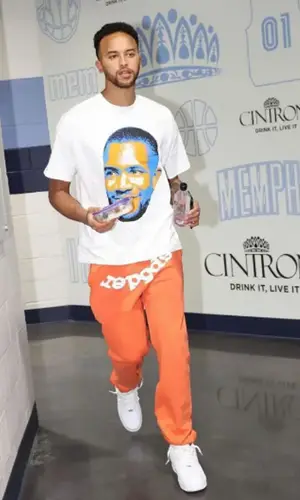 Kyle Anderson wearing Grace Court Co t-shirt