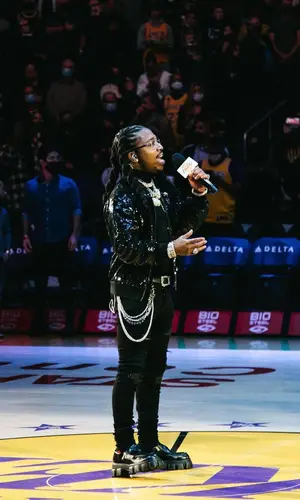 Jacquees wearing Saint Laurent belt