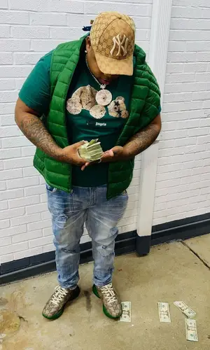 Big Yavo wearing Palm Angels t-shirt