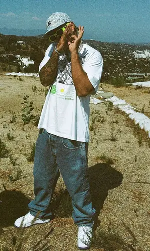 Feid wearing Brain Dead t-shirt