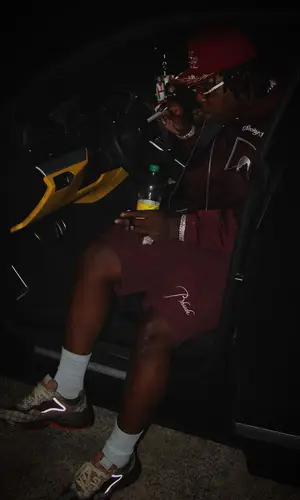 EST Gee wearing Rhude hat