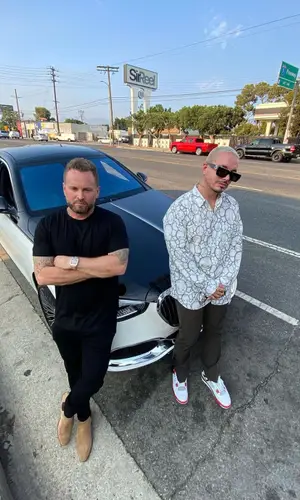 J Balvin wearing Comme Des Garcons shirt