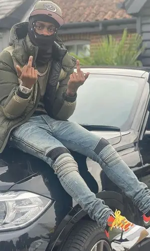Russ Millions wearing New Era cap