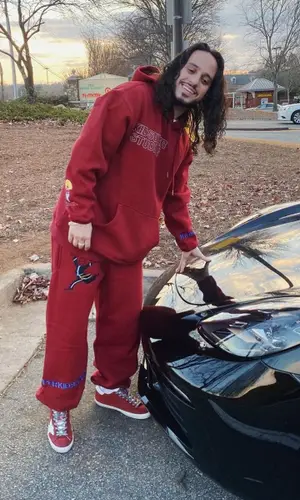 Russ wearing KidSuper hoody