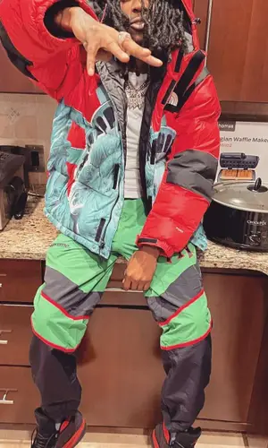 Baby Smoove wearing Supreme jacket