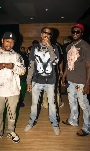 Quavo wearing Givenchy sweater