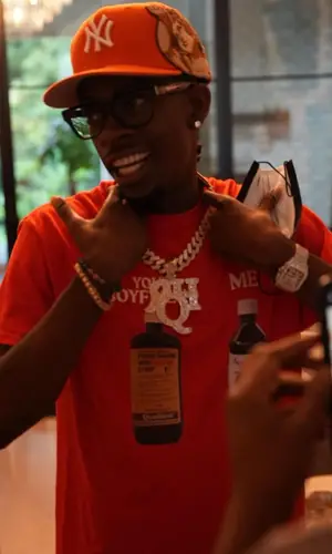 Rich Homie Quan wearing Jon Stan cap
