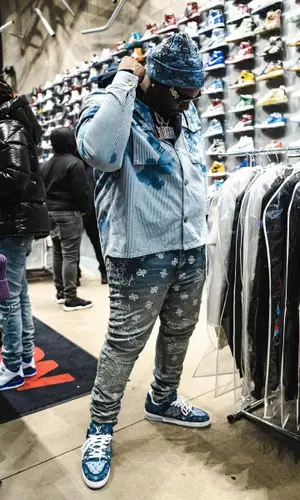 Peezy wearing Louis Vuitton shirt