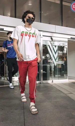 Cade Cunningham wearing Gucci pants
