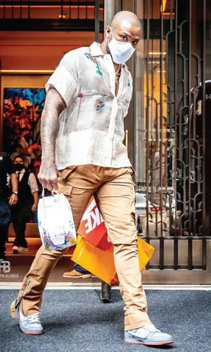 PJ Tucker wearing Louis Vuitton bag