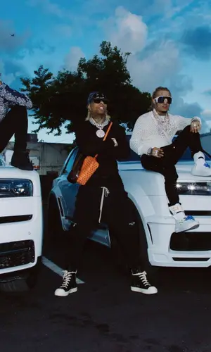 Ronny J wearing Goyard bag