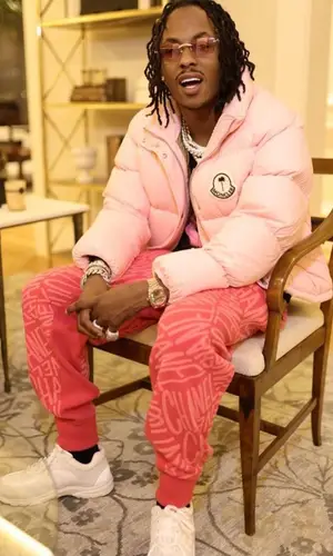 Rich The Kid wearing Chanel pants