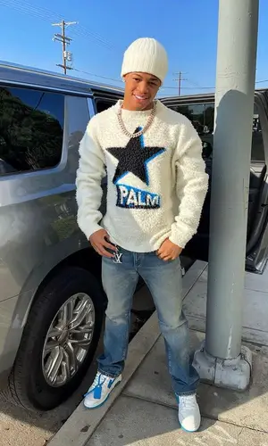 YK Osiris’ Outfit in Palm Angels Sweater, Moncler Hat & Louis Vuitton (2021)