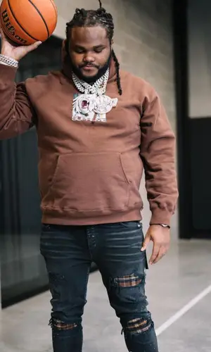 Tee Grizzley wearing Supreme sweatshirt