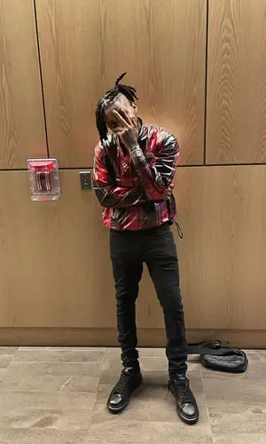 DDG wearing Louis Vuitton wallet