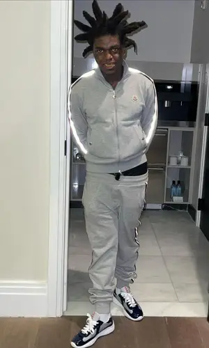 Kodak Black wearing Moncler sweatshirt