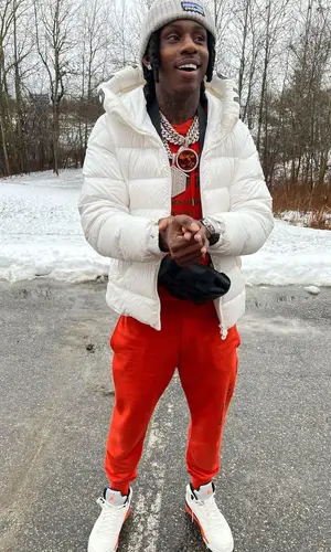 Polo G wearing Patagonia hat