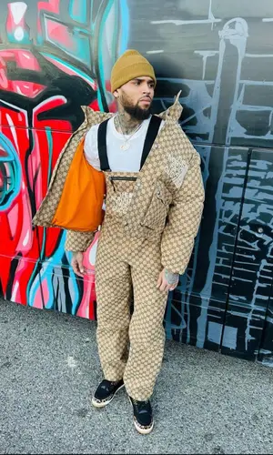 Chris Brown wearing Gucci jacket