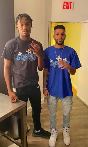 Lil Tjay wearing Nike sock