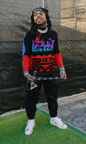 Jacquees wearing Louis Vuitton sweatshirt