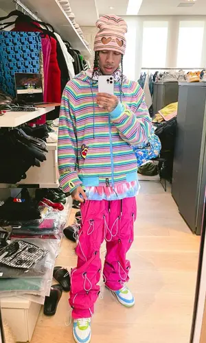 Tyga wearing 99%IS hat