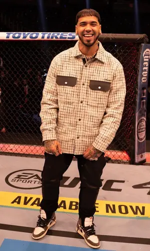 Anuel AA wearing Amiri jeans