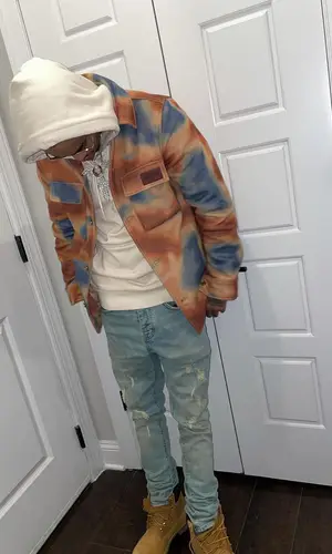 Nechie wearing Timberland boots