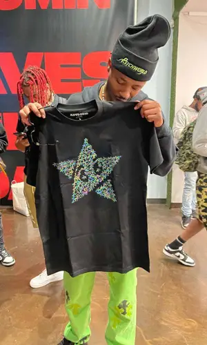 Metro Boomin wearing Astrokid t-shirt