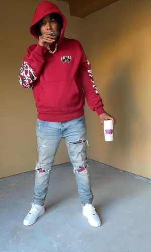Ballout wearing Amiri jeans