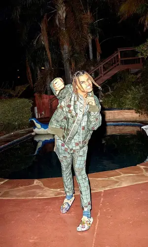 24kGoldn wearing Sacai pants
