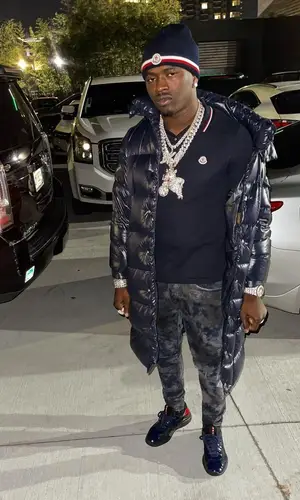 Bankroll Freddie wearing Moncler shirt