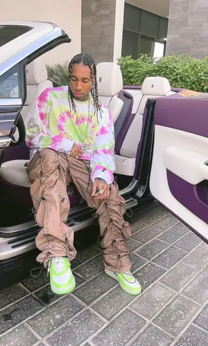 Tyga wearing 99%IS t-shirt