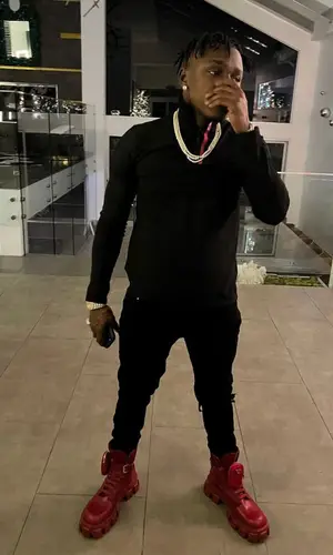 DaBaby wearing Prada top