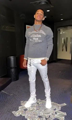 YK Osiris’ Outfit in Dior Sweater, Amiri Jeans & Louis Vuitton (2021)