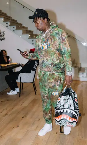 Fredo Bang wearing The Art Dealrs jacket