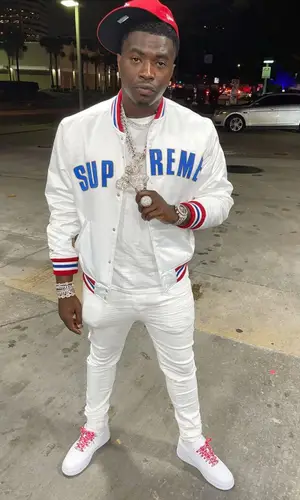 Bankroll Freddie wearing New Era cap