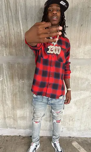Polo G wearing New Era cap