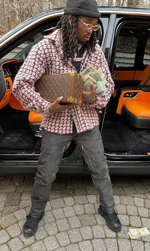 Quavo wearing Givenchy jeans
