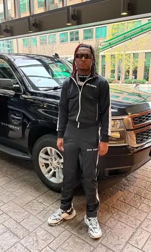 Lil Keed wearing Palm Angels jacket
