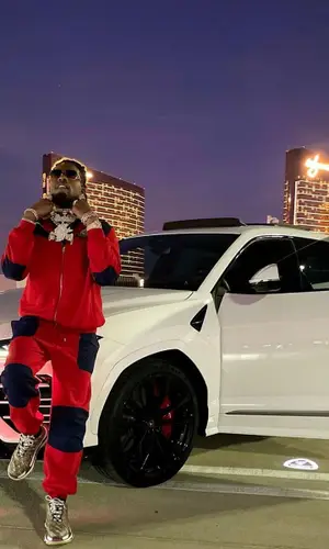 CJ So Cool wearing Gucci pants