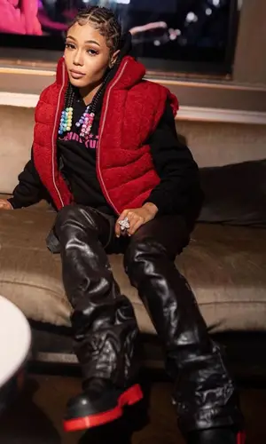 Coi Leray wearing Bottega Veneta boots