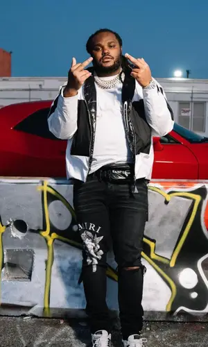 Tee Grizzley wearing Moncler jacket