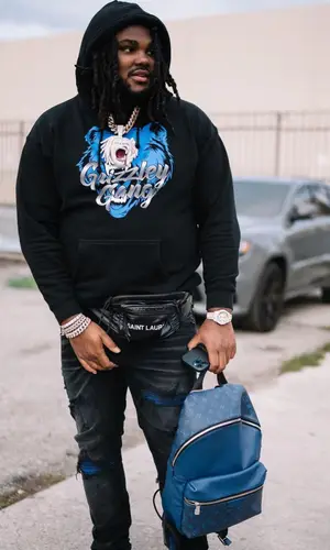 Tee Grizzley wearing Saint Laurent bag