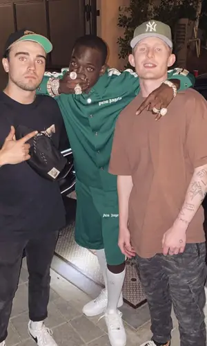 Bobby Shmurda wearing Palm Angels shirt
