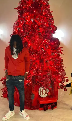 Polo G wearing Louis Vuitton top