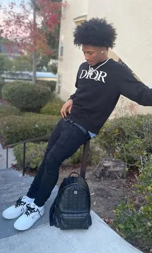 Mikey wearing Valabasas jeans