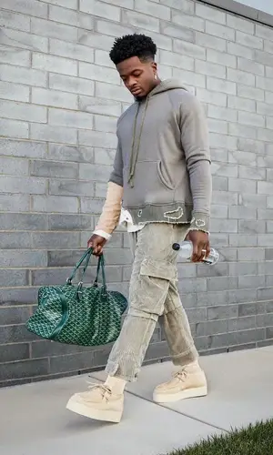 Marquise Goodwin wearing Goyard bag