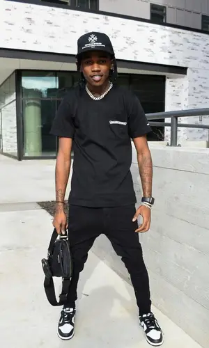 Jhacari wearing Nike sneakers