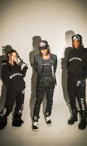 UnoTheActivist wearing Converse sneakers