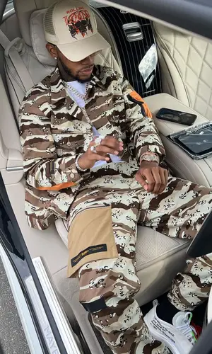 Toosii wearing Bape jacket